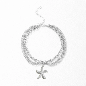 Multi-layer stainless steel anklet with vintage starfish pendant on white background