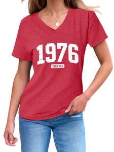 Close-up of red V-neck T-shirt with white 1976 vintage graphic and soft fabric texture