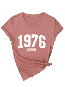 Detail of vintage 1976 V-neck T-shirt showing cracked print and stylish front hem knot
