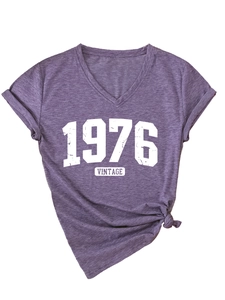 Detail of V-neck heather purple tee with vintage 1976 print and stylish side knot