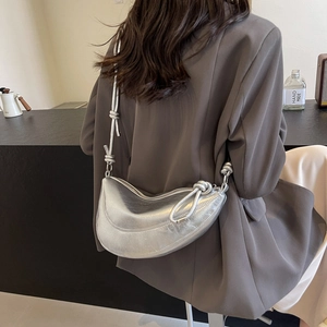 Chic silver crescent crossbody bag for women with stylish knotted shoulder strap detail