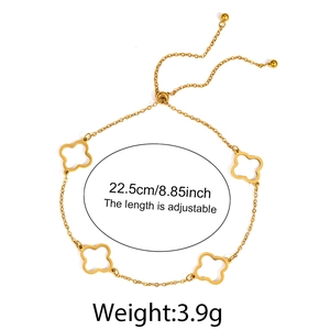 Detail view of 18K gold hollow four-leaf clover anklet with adjustable slider and bead end