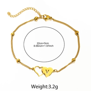 Detail of gold heart anklet with letter V pendant and lobster clasp measurement