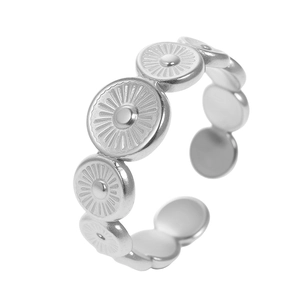 Silver adjustable geometric ring featuring sunburst textured circular patterns on steel