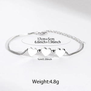 Polished stainless steel box chain bracelet featuring three heart-shaped charms and measurements