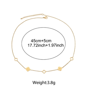 Detail view of gold clover necklace with dimensions 45cm+5cm and 3.8g weight specs