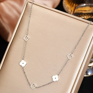 Minimalist silver stainless steel four-leaf clover necklace with hollow pendant design
