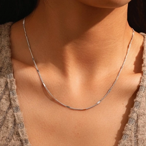 Minimalist stainless steel link chain necklace for women shown on neck model