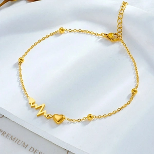 Detail of gold heart pendant anklet with pulse wave design and lobster clasp closure