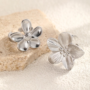 Modern silver flower ring set in stainless steel with textured petal details