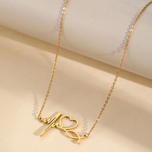 Collier en acier inoxydable doré poli avec pendentif battement de cœur et cœur sur support
