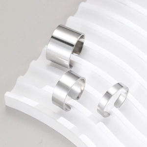Polished stainless steel minimalist open ring set in three widths on white display stand