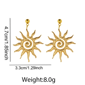 Detailed view of hammered gold sun earrings with spiral pattern and size measurements