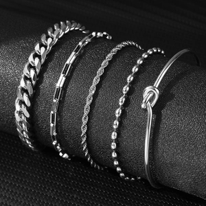 Detailed view of silver stainless steel Cuban and paperclip chain bracelet set on display