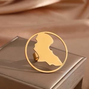 Golden stainless steel Africa map cutout ring on silk background for men and women