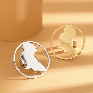 Macro detail of adjustable hollow circular rings with abstract African map silhouette