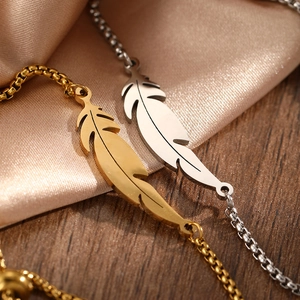 Feather charm bracelets in gold and silver finish with elegant box chain for women