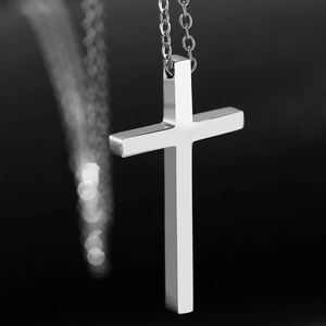 Polished stainless steel cross pendant necklace for men and women on black background