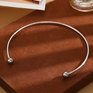 Minimalist silver stainless steel open torque necklace with polished spherical beads