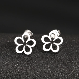 Minimalist stainless steel hollow flower stud earrings with a polished silver finish