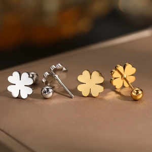 Macro detail of polished stainless steel clover stud earrings with screw ball backs
