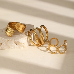 Three-piece gold adjustable stainless steel rings set with irregular textures for women