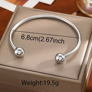 Polished stainless steel bangle detail with dimensions 6.8cm and 19.5g weight