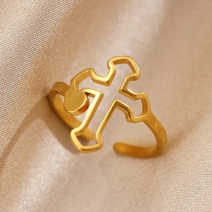 Minimalist gold hollow cross open ring made of stainless steel for women on champagne silk