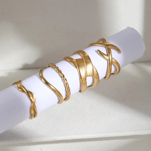 5-piece gold stainless steel geometric ring set with braided and hollow layered designs