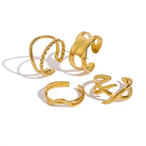 Set of 4 gold minimalist geometric stainless steel open rings with twisted and layered designs