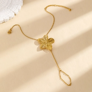 Elegant 18K gold plated sunflower ring bracelet set on a warm minimalist background