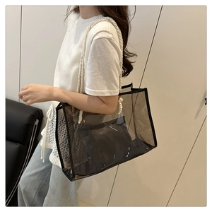 Transparent smoke gray PVC tote bag with black piping and rope handles details