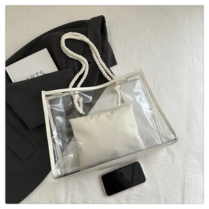 Detail of transparent PVC tote bag with white inner pouch and cotton rope handles