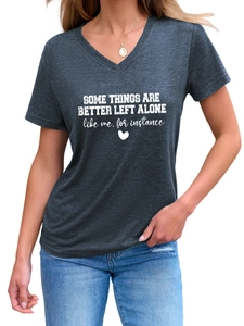 Close-up of dark grey V-neck T-shirt with white art text and heart graphic print