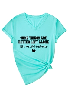 Detail of mint green V-neck T-shirt with side knot hem and black text art print