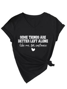 Detail of black V-neck t-shirt featuring a white slogan print and side knot design