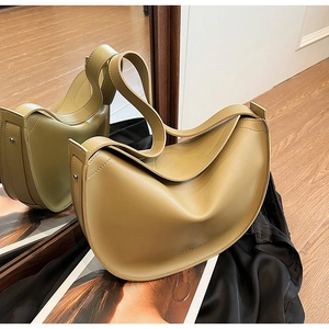 Macro shot of an olive green hobo bag featuring premium matte PU leather and fine stitching