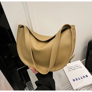 Close-up of a khaki half-moon shoulder bag in premium PU leather with wide strap