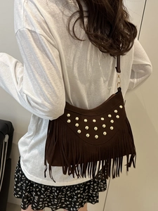Dark brown suede tassel shoulder bag with gold studs and bohemian fringe for women