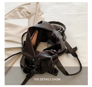 Internal view of dark brown tote bag showing spacious capacity and organized storage