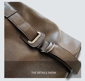 Detailed close-up of dark brown tote bag with premium lychee texture and silver hardware