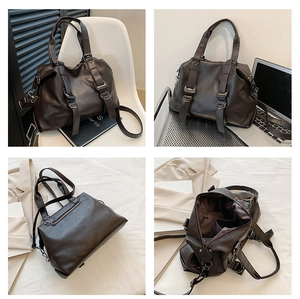 Detail view of large dark brown tote bag interior compartments and crossbody strap
