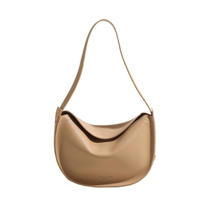 Beige faux leather hobo bag with a crescent shape and long shoulder strap in minimalist style