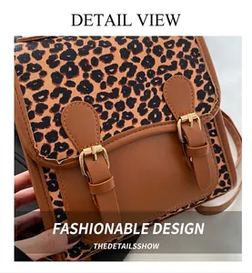 Detail shot of leopard print flap crossbody bag with premium gold buckles and PU leather