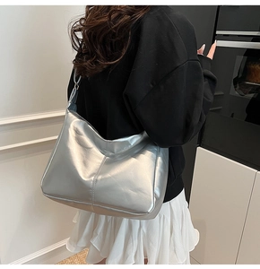 Detailed view of silver metallic Hobo bag showing reflective texture and large capacity