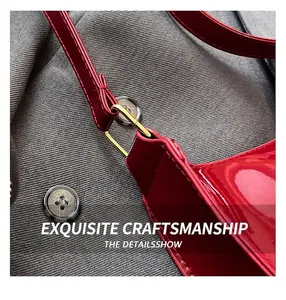 Detail of red patent leather shoulder bag with glossy finish and gold square metal buckle
