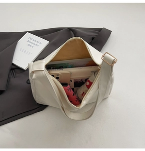Top view of cream white tote bag interior showing capacity for umbrella and books