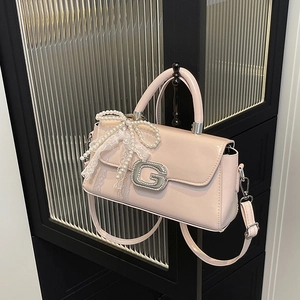Pink patent leather square handbag with rhinestone G-logo and pearl lace bow charm