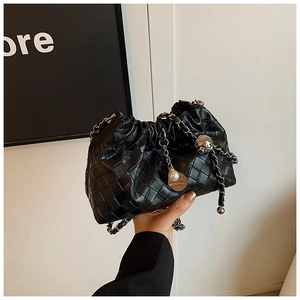 Detail of black woven cloud bag with silver chain strap and pearl decorative charms