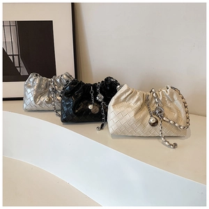 Three woven chain purses in silver, black and cream colors with pearl charms